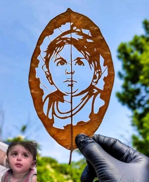 فن المصغرات يجسد ملامح طفلة غزة على ورقة شجر